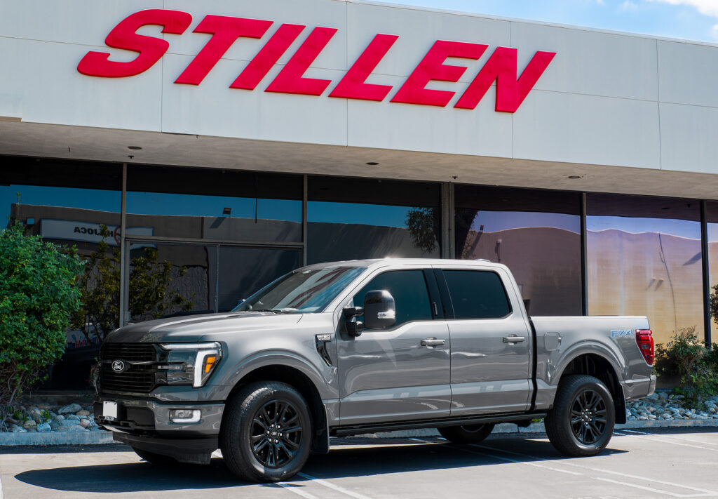 2021–2025 Ford F-150 with STILLEN Cat-Back Exhaust System parked at STILLEN headquarters